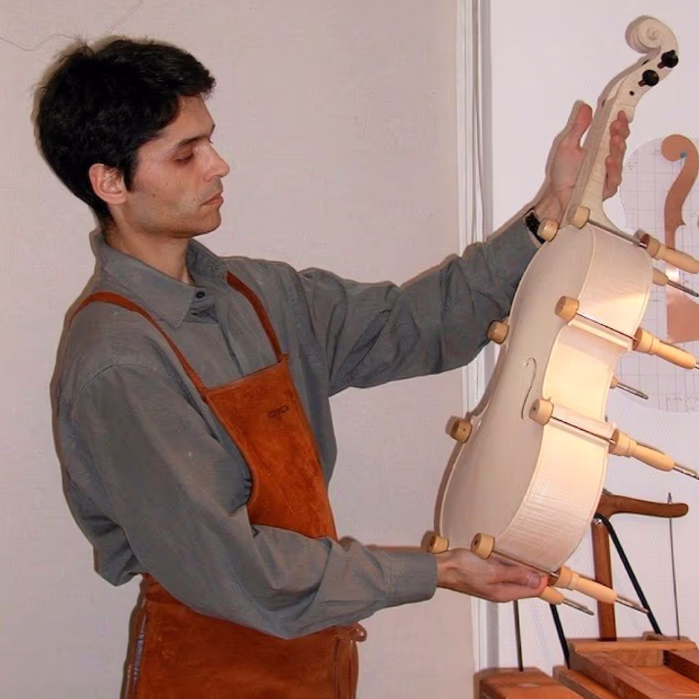 Dmitry Badiarov in Brussels in 2003 with the first violoncello da spalla still in white before varnishing